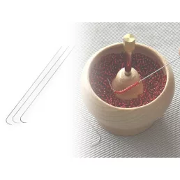 Tű gyöngyökre hajlított