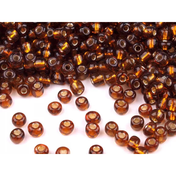 Üveg kásagyöngyök 6/0 - 4 mm-es áthúzóval - 53 rozsdaszín (450 g-os csomagolás) Üveg kásagyöngyök 6/0 - 4 mm-es áthúzóval - 53 rozsdaszín (450 g-os csomagolás)