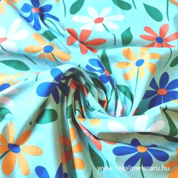   Small multicoloured flowers turquoise green on a background cotton percale
