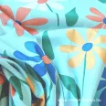  Small multicoloured flowers turquoise green on a background cotton percale