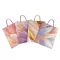 Ajándéktasak tollak csillámporral 26x32 cm - variáns készlet (12 db-os csomagolás)